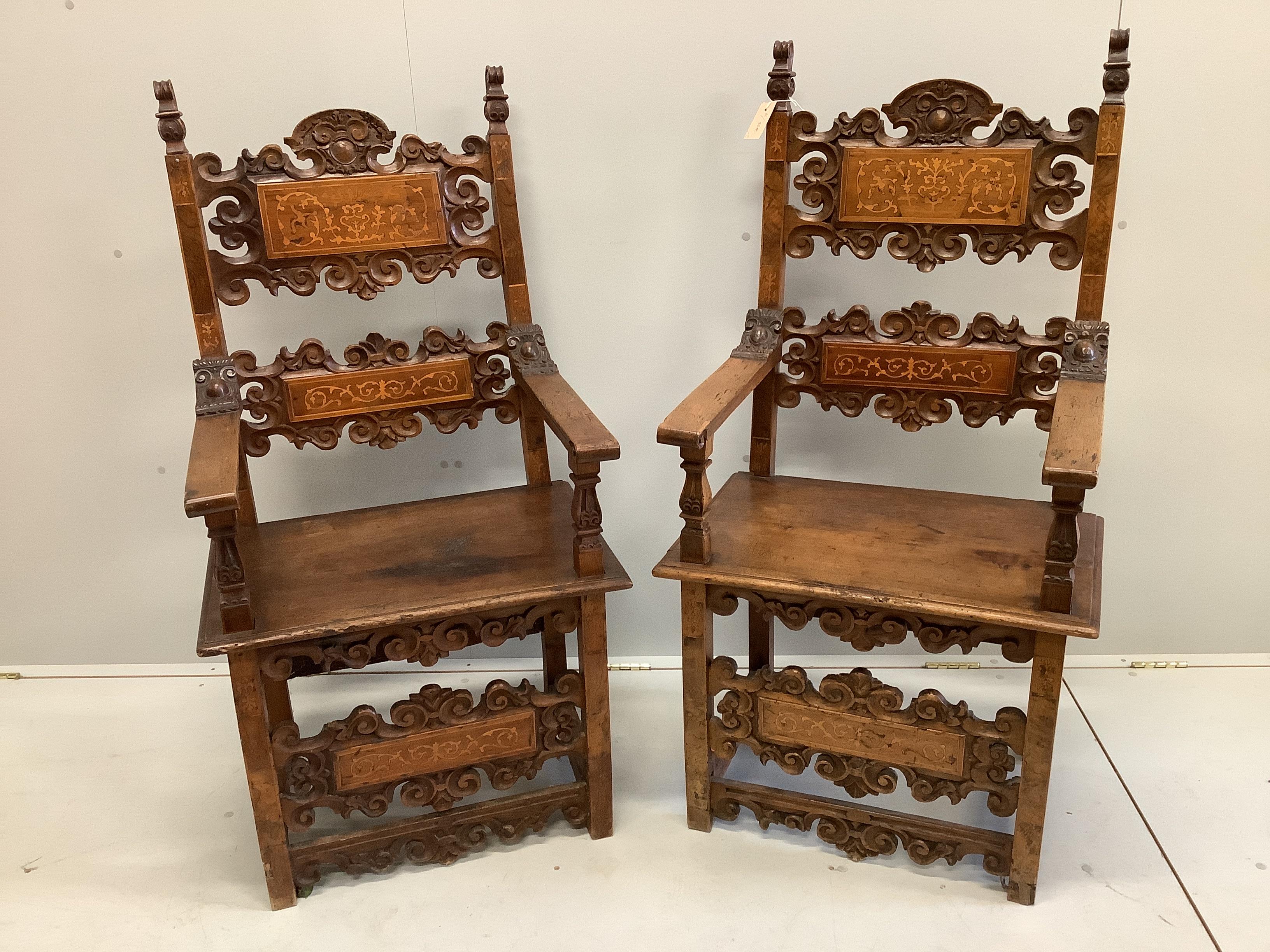A pair of 18th century style carved inlaid walnut elbow chairs, width 57cm, depth 49cm, height 124cm